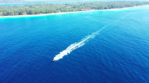 speedboat drifting in the blue calm ocean. Aerial panorama. seascape with the tropical islands alt