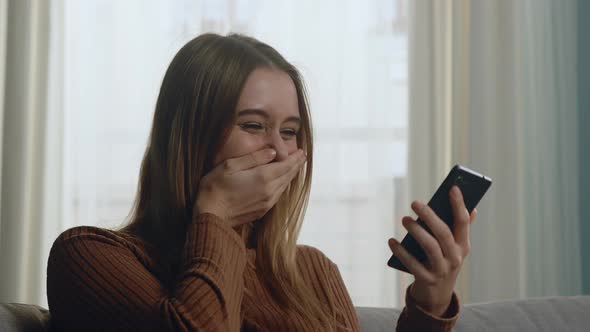 Girl Is Happy Because of What She Saw on Her Mobile Phone