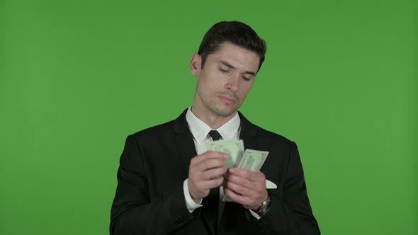 Greedy Businessman Counting Money and Asking for More, Chroma Key alt