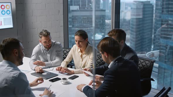 Smiling business people having a brainstorm in a meeting room alt
