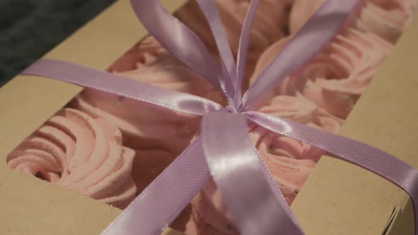 A Box of Berry Marshmallows Tied with Purple Satin Ribbons
