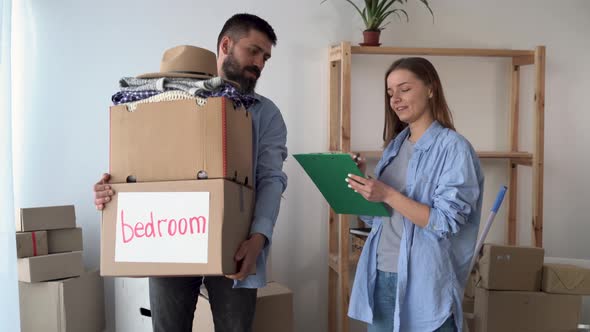 Couple in Love in a New Empty Apartment are Standing alt