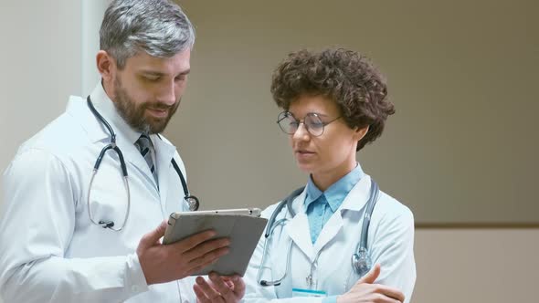 Two doctors with tablet computer