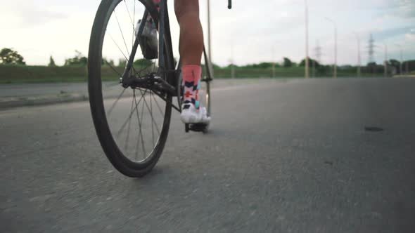 Young Handsome Hipster Man Riding Fixed Gear Bicycle During Sunset Outdoor alt