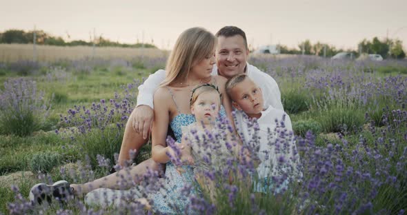 Portrait of a Young Family on a Lavender Field alt