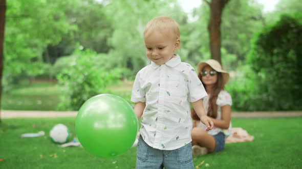 Smiling Toddler Standing in Park. Children Playing Together Outdoors alt