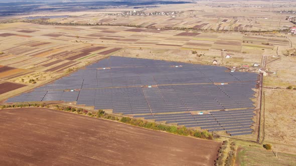 Zoom Aerial View of Solar Panels Farm Solar Cell with Sunlight