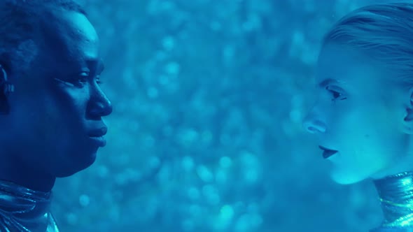 Side View of Futuristic Man and Woman in Blue Laser Light alt