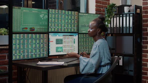 Bank Analyst Taking Notes on Clipboard to Plan Financial Strategy alt