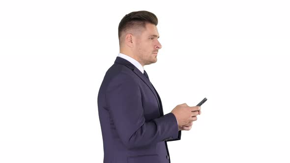 Mature Businessman Using Mobile Phone Texting Message on White Background alt