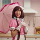 Playful Charming Asian Female in Maid Cosplay Costume Posing with Pink Umbrella - VideoHive Item for Sale