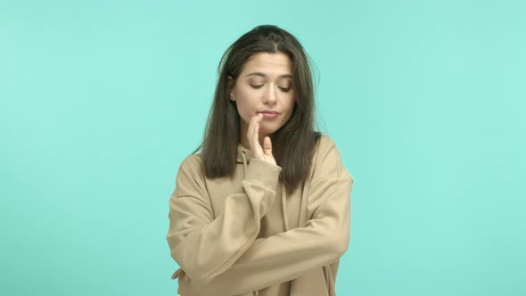 Annoyed Teenage Girl in Beige Hoodie Looking Bothered Making Facepalm and Roll Eyes Irritated with alt