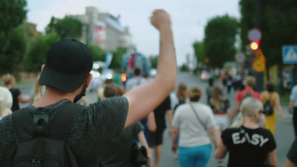 Coronavirus Lockdown Opposition Strike Rebel Resistance Man Waves Arm Fist alt