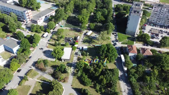 A small city in rural Bulgaria hosts a weekend festival. Children and adults gather to celebrate and alt