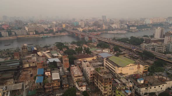 Aerial Rooftop Views Of Buildings Near Dhaka City River Port At Dhaka In Bangladesh. Pedestal Up alt