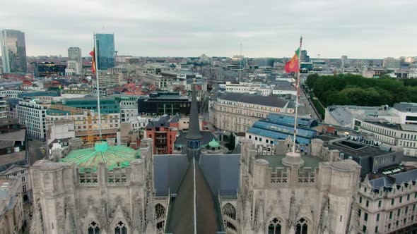 Establishing Aerial View of Cathedral with Flags As Brussels Landmark Belgium