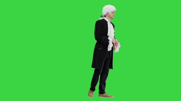 Man in 18Th Century Camisole and Wig Doing Welcoming Gesture on a Green Screen, Chroma Key. alt