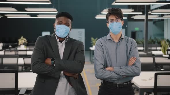 Two Businessmen African Arabian Colleagues Business Partners Managers Wearing Face Masks for Protect alt