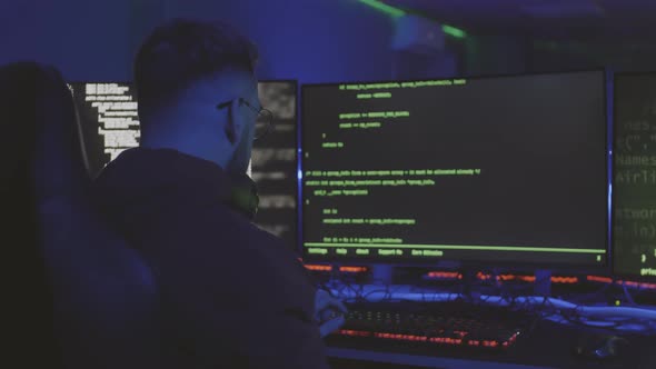 Male Caucasian Software Developer in Dark Room alt