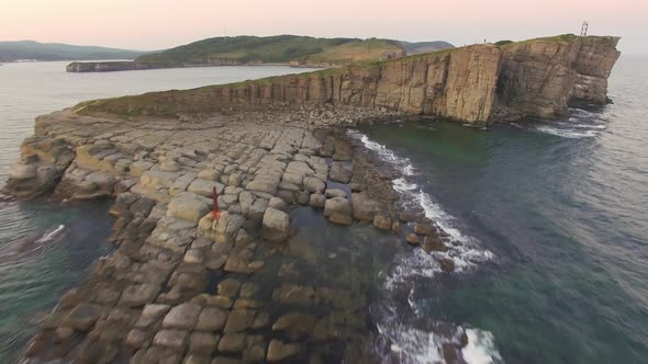Drone View of a Beautiful Peninsula Tobizina with Vertical Cliffs at Sunset alt