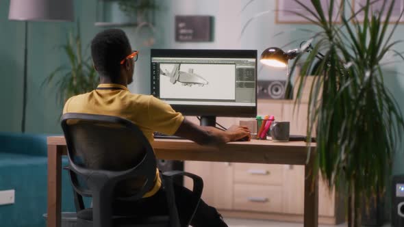 Black 3D Designer Working in Home Office alt