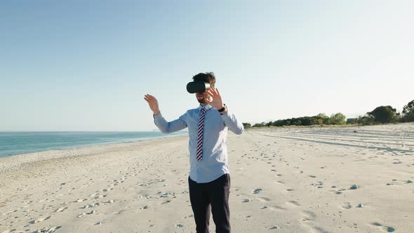 Boy with Blue Shirt Does the Metaverse Experience on the Beach in Summer alt