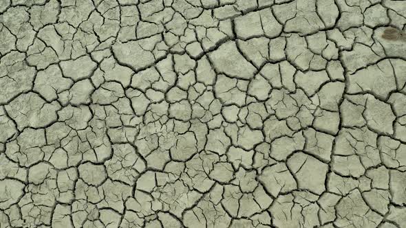 Lifeless Desert Land Dry Lake Bed with Cracked Ground