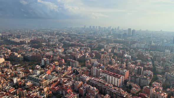 Aerial drone view of Barcelona, Spain. Multiple residential and office buildings, Mediterranean sea  alt