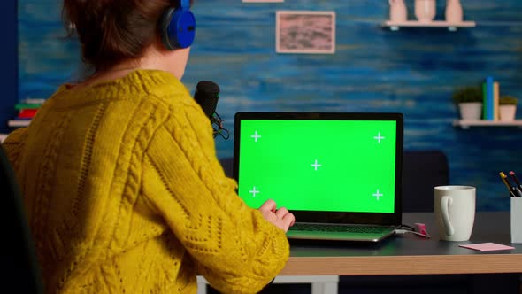 Influencer Answering at Messages Working with Green Screen Laptop alt