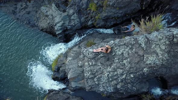 Woman Sitting On The Rocky Cliff Of Bokong Falls In Sagada alt