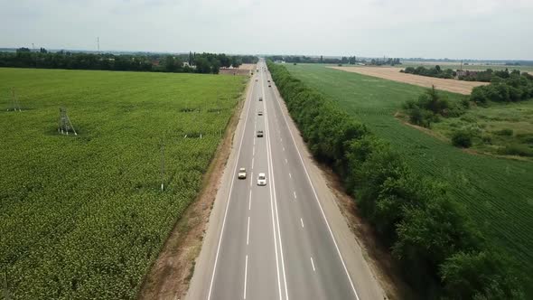 Aerial Fly Over Motorway, Freeway Traffic - Trucks and Cars on the Road alt