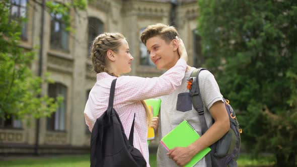 Couple of Students in Love Hugging and Nuzzling Before Classes University Life alt
