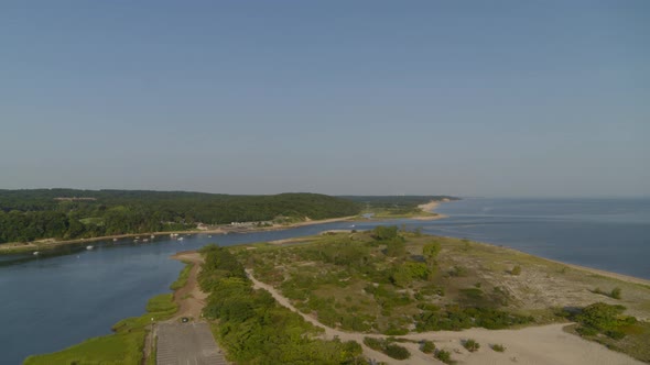 Slow Rising Aerial Shot of Smithtown Bay in Long Island on a Sunny Day alt