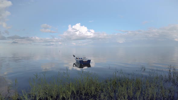 Fishing boat on the waves of the baltic in summer alt