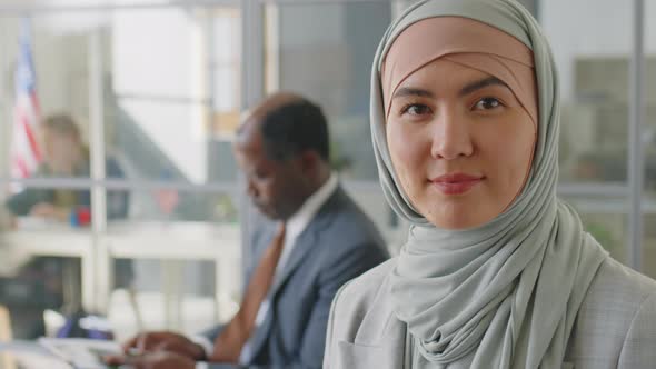 Portrait of Muslim Woman in Hijab before Visa Interview alt