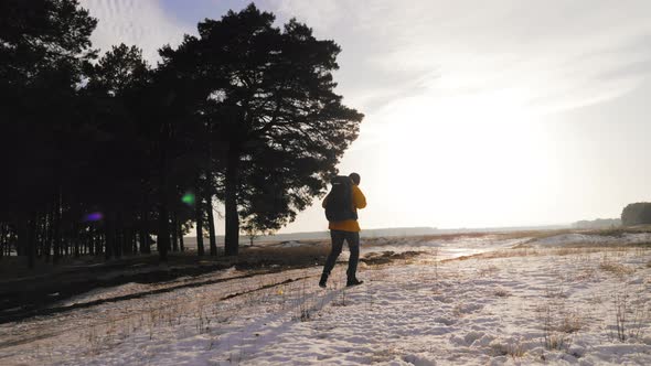 Silhouette Hiker Man Travelling Alone with Backpack alt