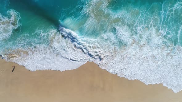 4K drone footage. Kelingking Beach in Nusa Penida, Bali, Indonesia. alt