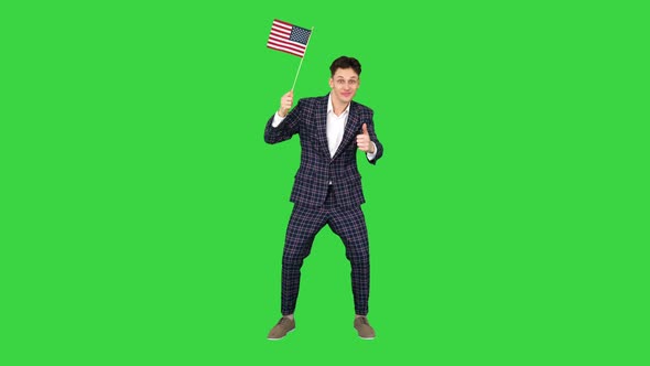 Young Man in Formal Suit Dancing in a Funny Way with American Flag on a Green Screen, Chroma Key alt
