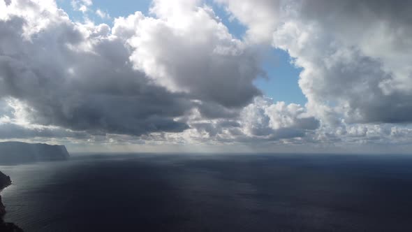 Abstract Airy Sky with Moving Plump Clouds Over the Sea Ocean alt