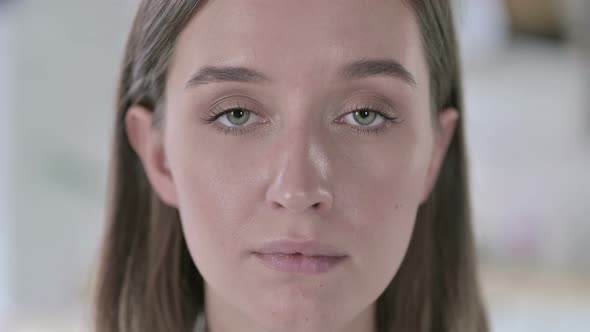 Close Up of Young Woman Looking at Camera alt