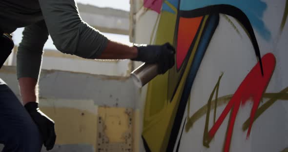 Graffiti artist painting with aerosol spray 4k alt