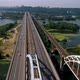 Aerial top view of automobile and railroad Darnitsky bridge across Dnieper river from above - VideoHive Item for Sale