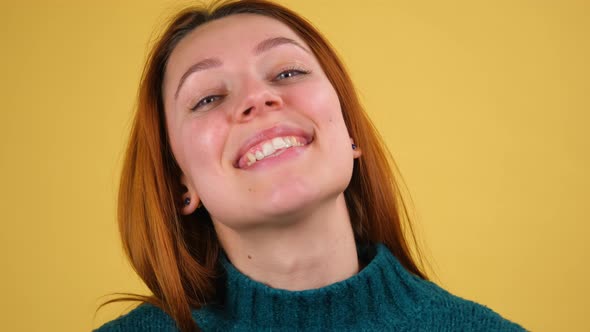 Young Red Hair Woman Posing Isolated on Yellow Color Background Studio alt