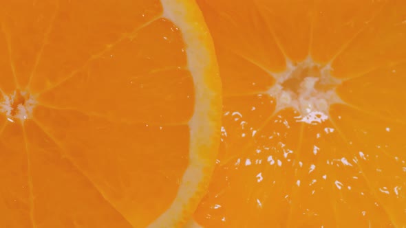 Fresh Citrus Fruit Slices of Orange on Rotating Surface  Top View Close Up
