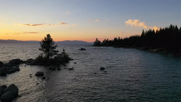 Flying Over Scenic Lake Tahoe At Sunset In California, USA - aerial drone shot alt