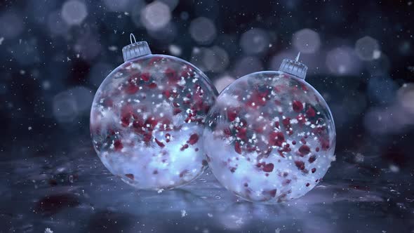 Two Christmas Rotating Blu Ice Glass Baubles snow red petals background loop