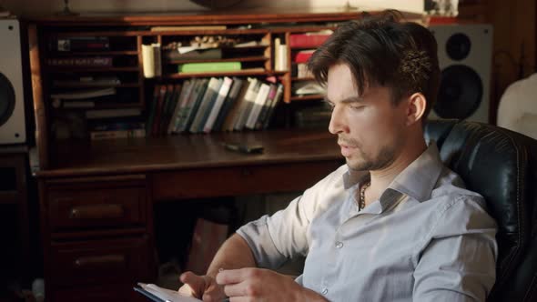 Portrait of a Man Who Takes a Pencil to Write Down an Important Thought