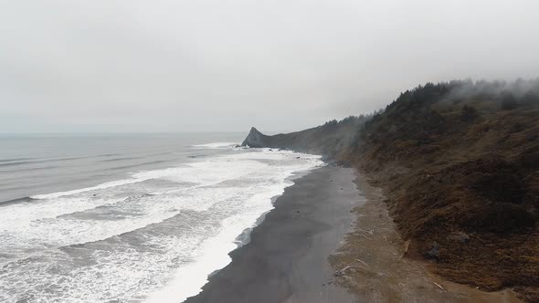 Bird's-eye view of Sharp Point mountain, ocean waves,shore in Dry Lagoon State Park, California, USA alt