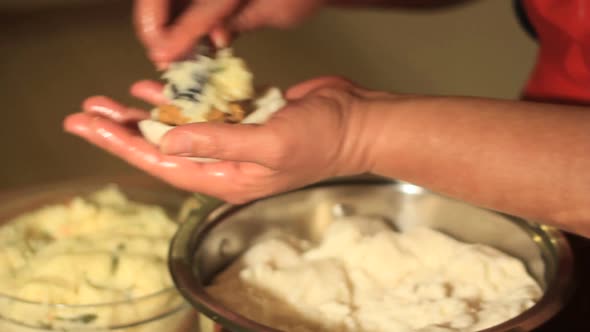 Pupusas making by woman hands close up
