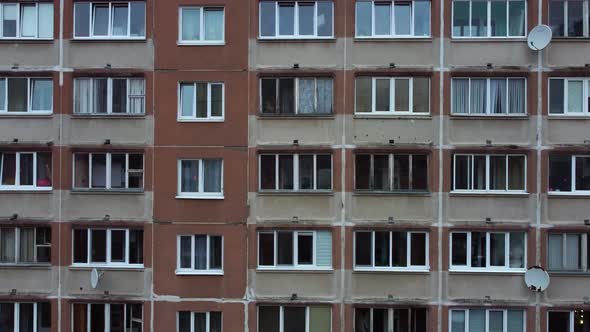 A drone rises near a scary depressive Soviet-style residential building. alt
